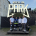 4 ehrenamtliche EInsatzkräfte des BRKs stehen vor dem Rock im Park Logo-Schild.